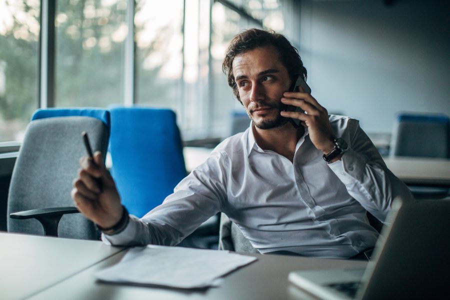 Businessman talking on mobile in office